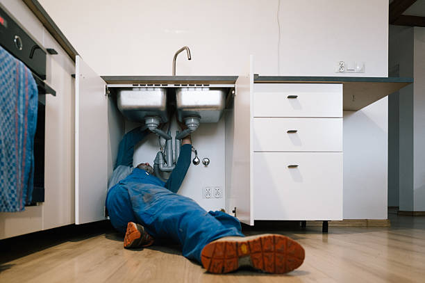 Professional Emergency Plumber technician working in Maynard, MA